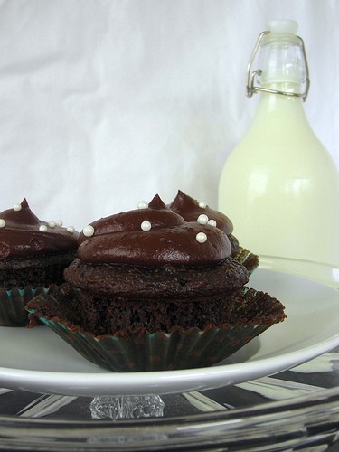 Side view of two Chocolate Cream Cheese Cupcakes on a plate