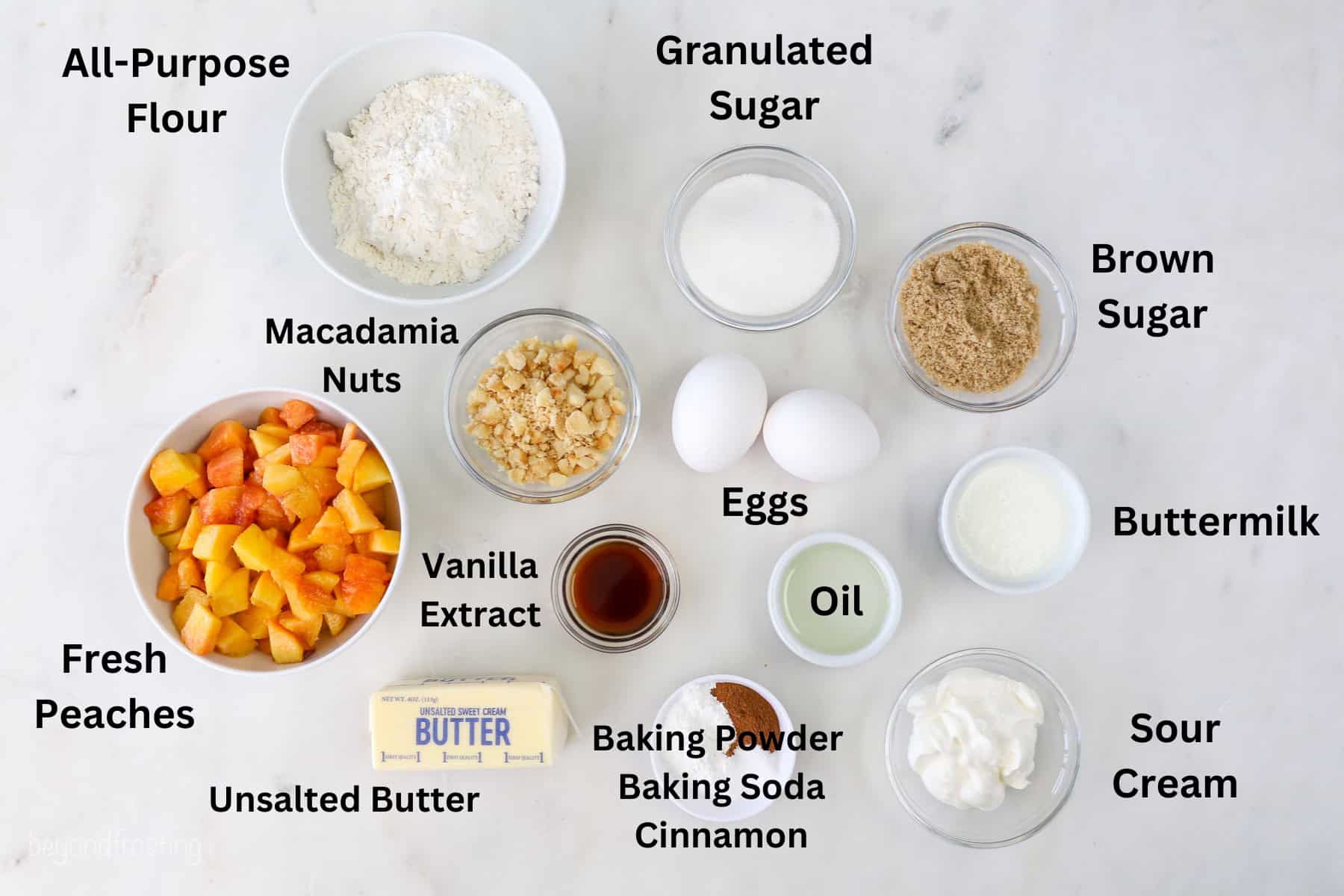 Ingredients for peach macadamia nut muffins with text labels over each ingredient.