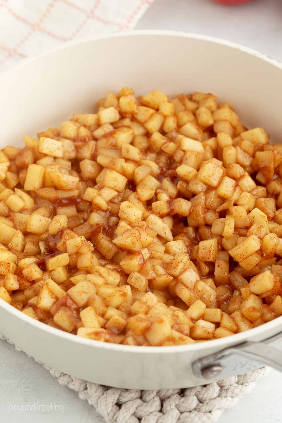 Golden-fried apple pie bites are easy to make, with refrigerated pie dough and gooey homemade apple pie filling. Like bite-sized apple pies! Homemade cinnamon apple pie filling in a pot.