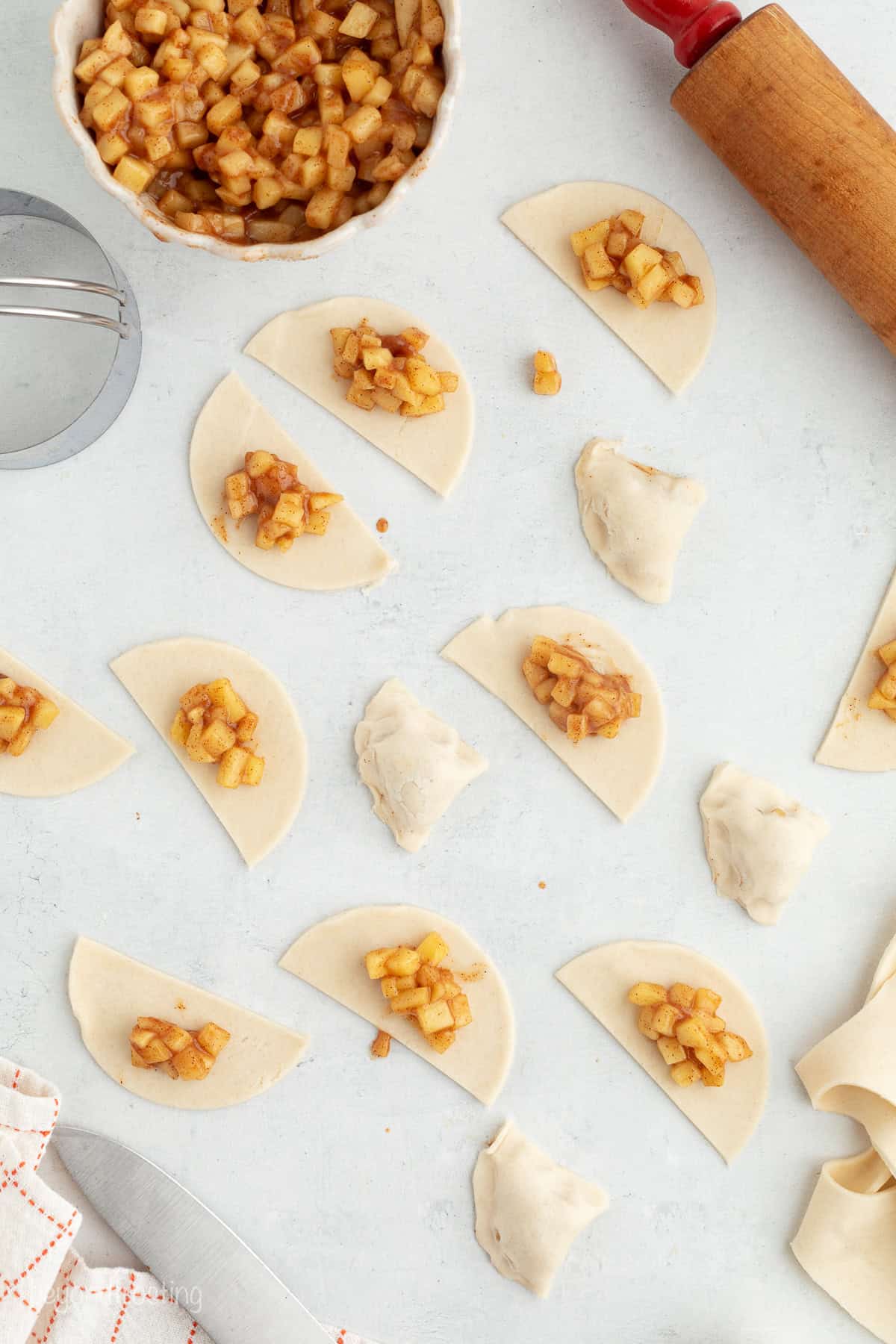 Golden-fried apple pie bites are easy to make, with refrigerated pie dough and gooey homemade apple pie filling. Like bite-sized apple pies! Homemade apple pie filling added to cut-out pie dough to make apple pie bites.