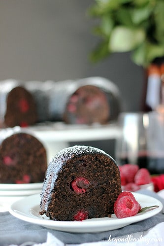 Close-up of a slice of chocolate raspberry cabernet cake on a plate