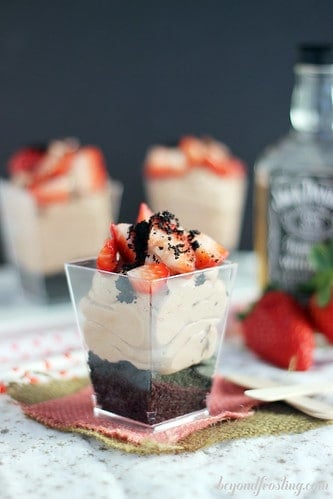 Spiked Chocolate Parfait in a dessert cup topped with strawberries