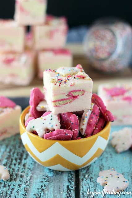 A square of Circus Animal Fudge on top of a bowl of Circus Animal Cookies