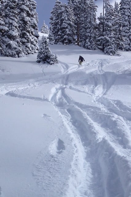 Author snowboarding down a snowy slope