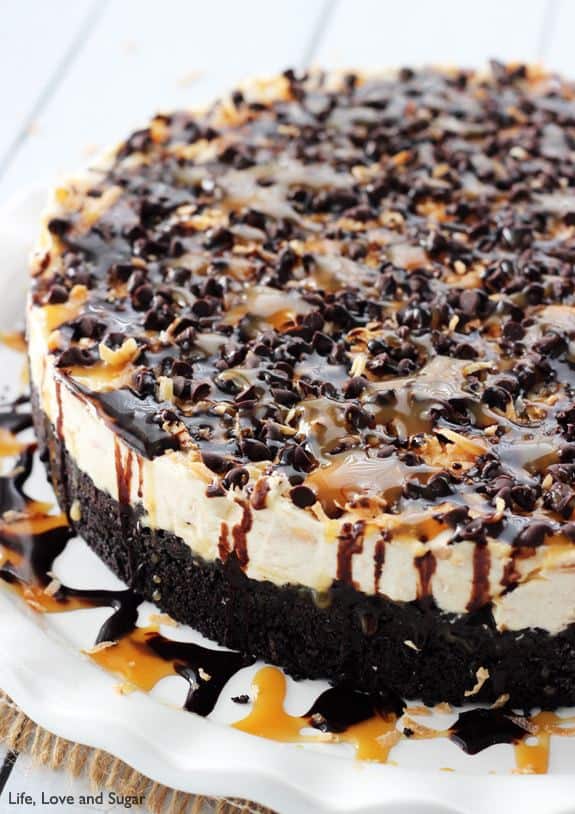 A Samoa Cheesecake Covered in Caramel and Chocolate Sauce