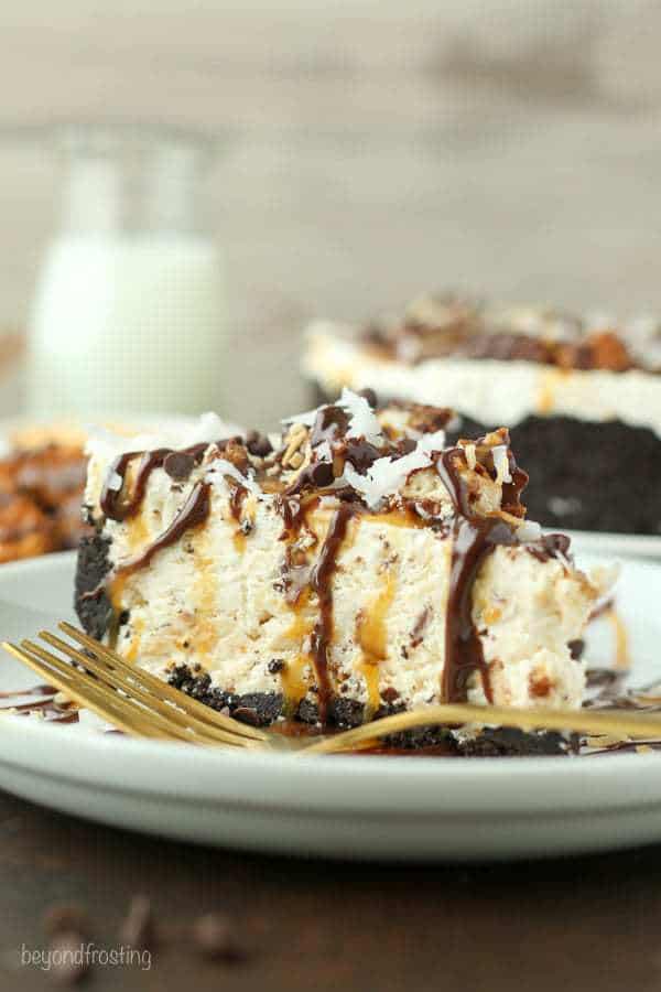 This Samoa Cookie Ice Cream Pie is oozing caramel and coconut. This has an Oreo cookie crust, with a caramel and coconut ice cream filling stuffed with Samoa cookies.