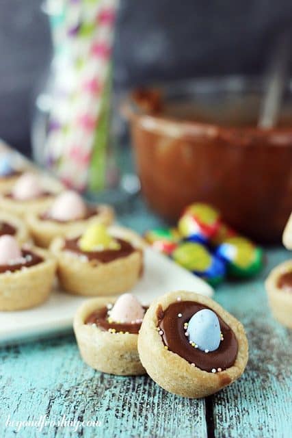 These cookie cups are filled with Cadbury ganache and topped with a candy egg.