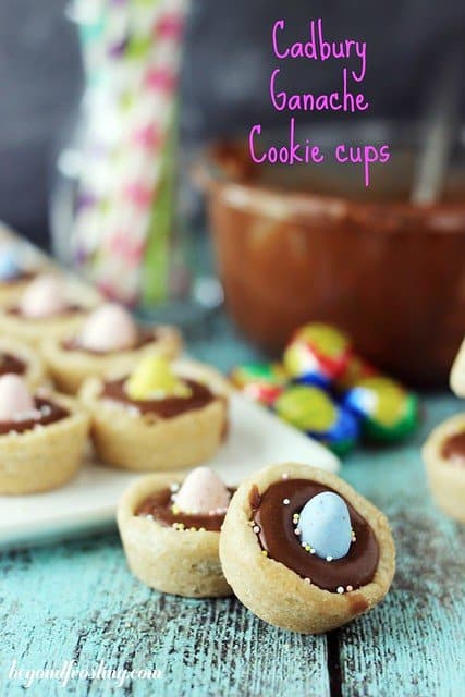 Cadbury Ganache Cookie Cups on a tray with two in front