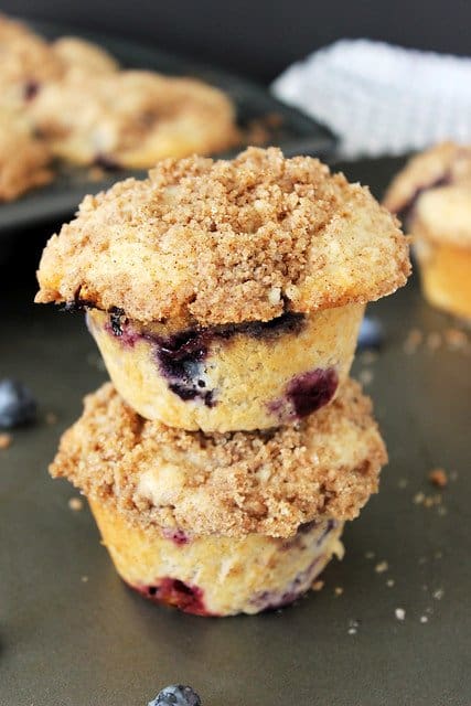 Two cinnamon blueberry muffins stacked