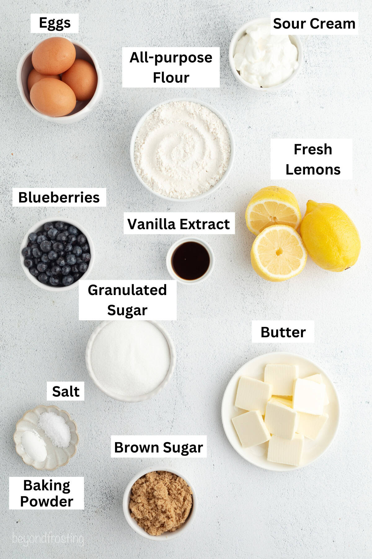 Lemon blueberry bundt cake ingredients with text labels overlaying each ingredient.