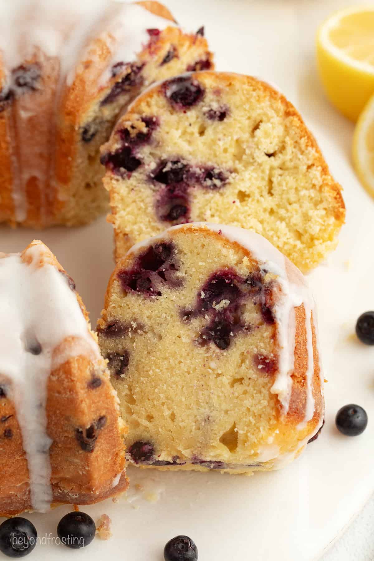 Lemon blueberry bundt cake cut into slices.