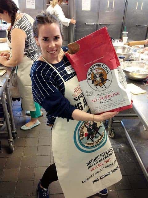 A picture of me holding a huge bag of King Arthur Flour.