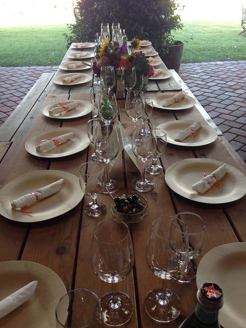 A long outdoor table with place settings