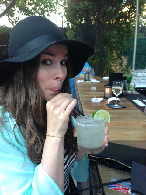 Author sipping a margarita at the closing party in Miami