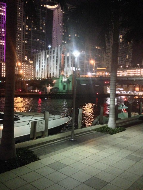 Nighttime view of yachts and high rise buildings in Miami