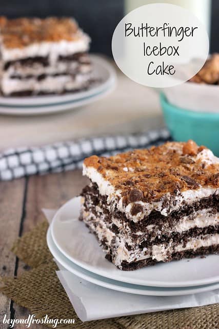 A square of layered Butterfinger Icebox Cake on two plates