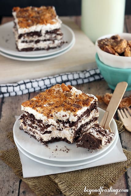 Overhead view of a square of Butterfinger Icebox Cake on a plate with a bite on a fork