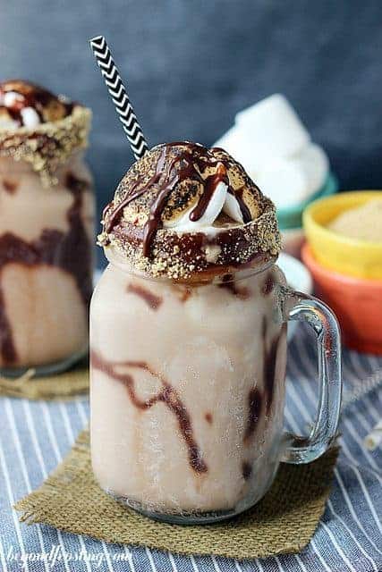 This boozy milkshake is made with bourbon, s'mores ingredients, and is everything you need this summer!