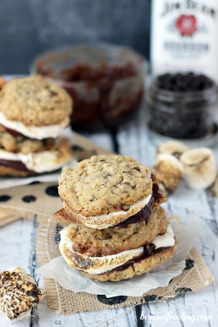 Two stacks of Bourbon Bacon Smores cookies on burlap