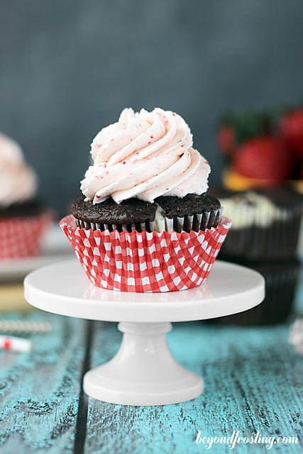 Chocolate Strawberry Cheesecake Cupcake on a cake stand