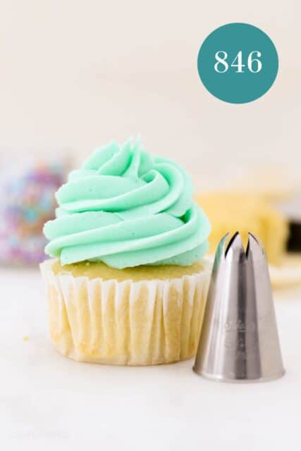 A #846 piping tip next to a frosted cupcake piped with a #846 swirl.