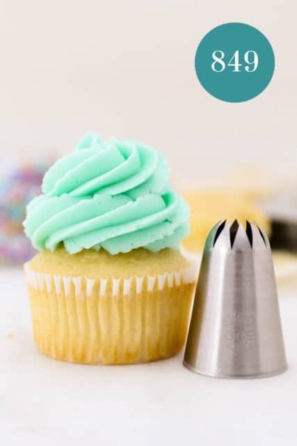 A #849 piping tip next to a frosted cupcake piped with a #849 swirl.
