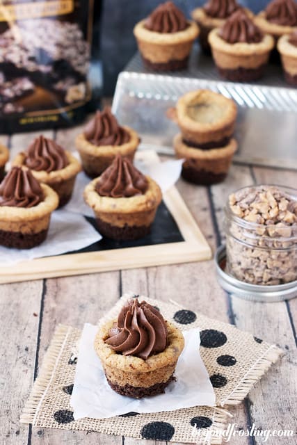 Brownie Brittle Toffee Crunch Cookie Cups on a napkin, a wooden board, and a metal tray