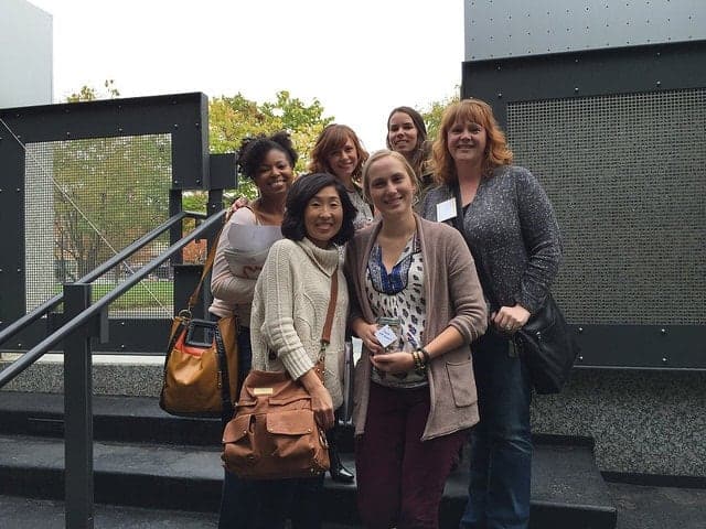 A group of food bloggers posing outside a building for the BHG Cooking Experience event