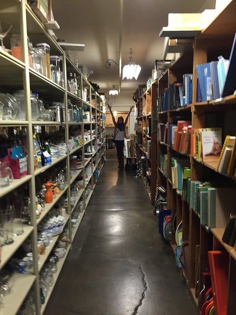 Shelves of kitchen accessories and books for food staging