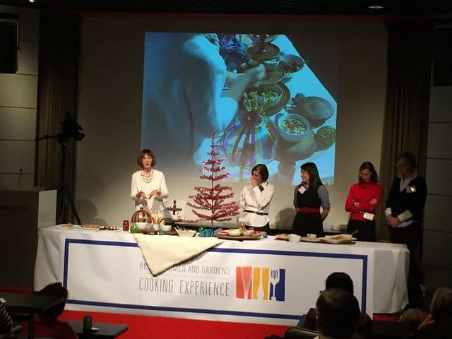 A food demonstration table with a pink tinsel tree at the BHG Cooking event