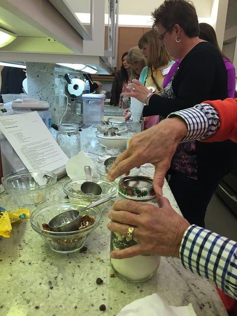 Food bloggers trying different cooking techniques in a kitchen