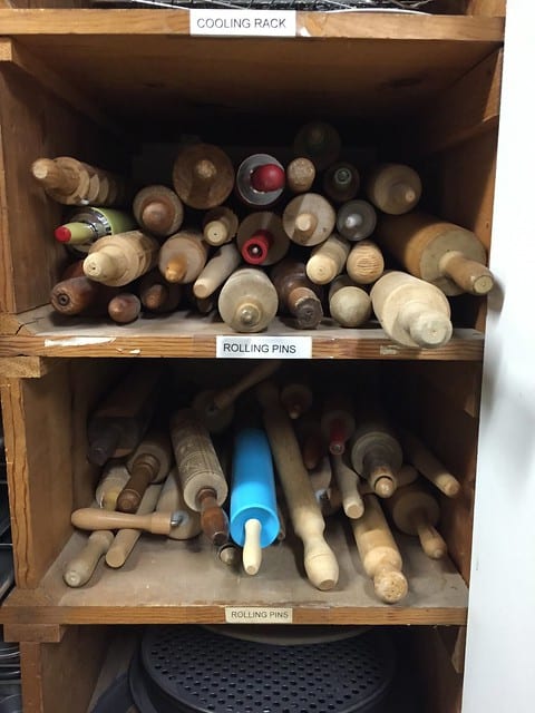 Two shelves of rolling pins