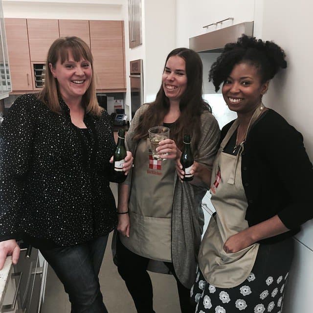 Three friends sharing a toast at the end of the baking contest