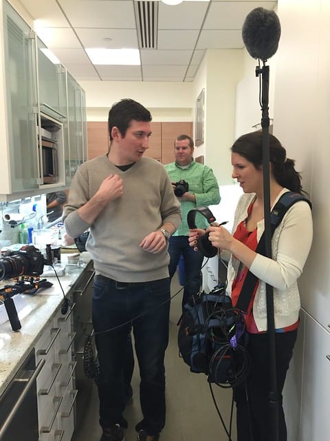 A film crew in the kitchen for the Ultimate Baking Challenge