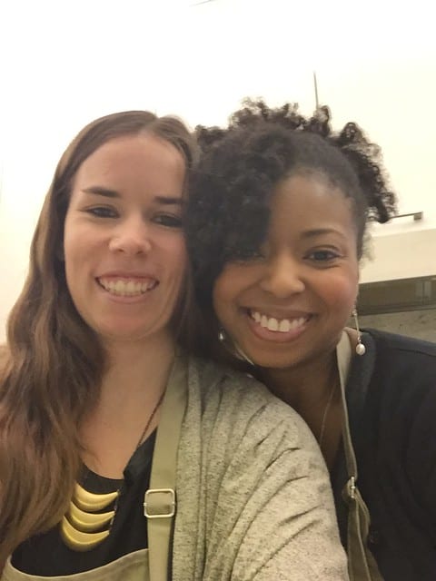 Two women posing and smiling together