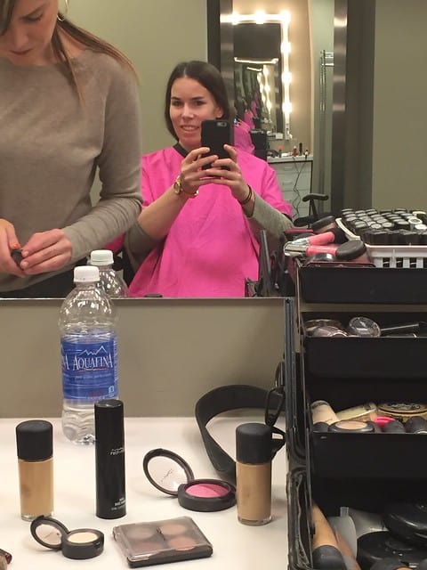 Author taking a selfie from the hair and makeup chair