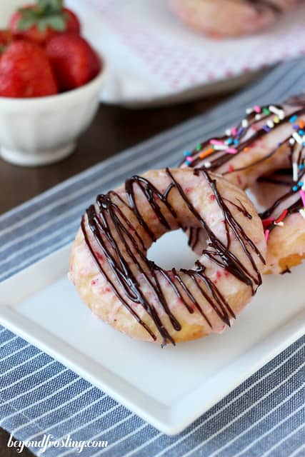 Chocolate Covered Strawberry Donuts lined up on a platter