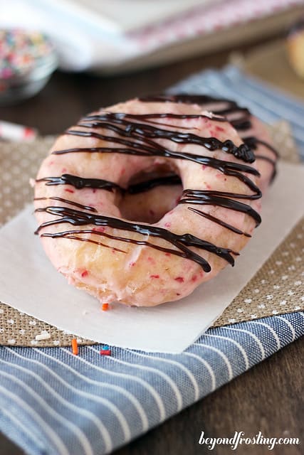Close-up of a Chocolate Covered Strawberry Donut on a napkin