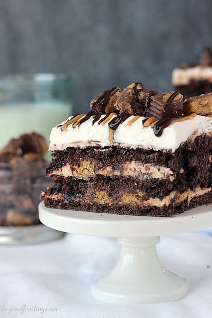 A serving of Chocolate Peanut Butter Cup lasagna on a mini cake stand