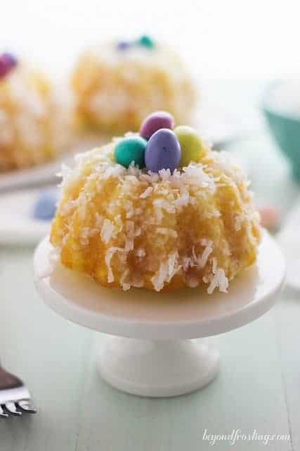 Mini Lemon Coconut Bundt Cake on a mini cake stand