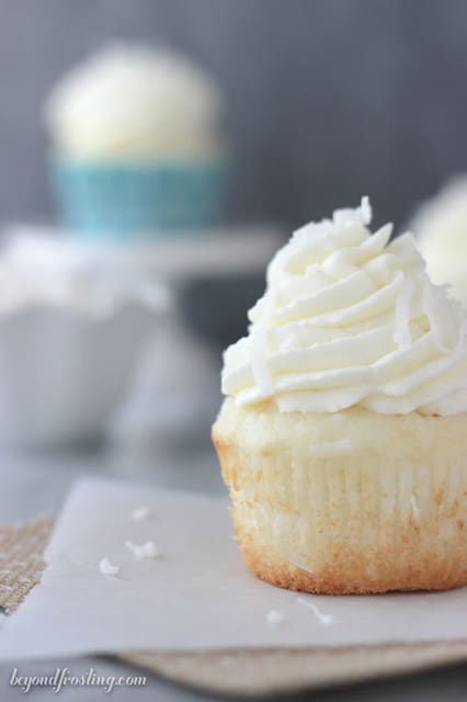 Close-up of a Coconut Cream Pie Cupcake on a napkin with the wrapper removed