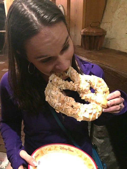 Author biting into a funnel cake at Disney