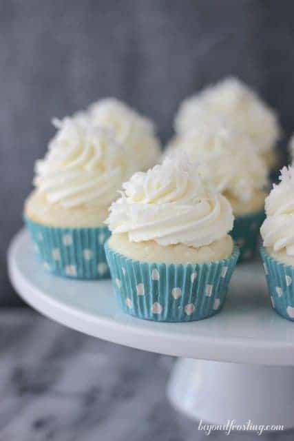 These Coconut Cream Pie Cupcakes are the perfect combination of coconut cake with a lightly sweetened coconut mousse and topped with a cream cheese whipped cream.