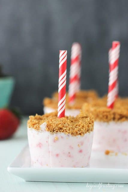 These Easy Strawberry Marshmallow Popsicles are the perfect dessert to make with your kids this summer. They taste just like a strawberry cheesecake and are topped with a graham cracker crust.