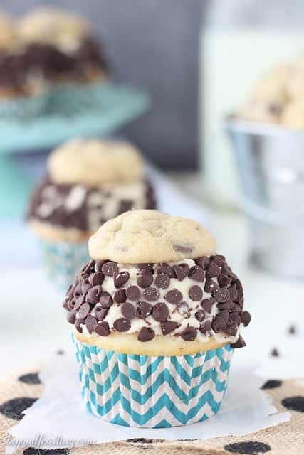 The Ultimate Cookie Dough Cupcakes. A vanilla malt cupcake with cookie dough frosting, rolled in chocolate chips and topped with a chocolate chip cookie!
