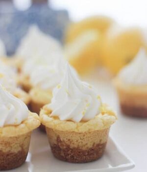 These Lemon Cream Pie Cookie Cups will knock you socks off. Full of lemon flavor, these cookie cups have an easy lemon mousse filling and topped with Fresh Whipped Cream.