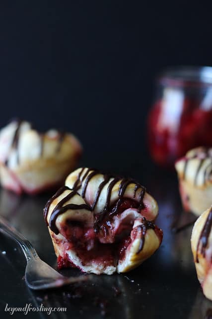 A Chocolate Cherry Monkey Bread Muffin with a bite removed