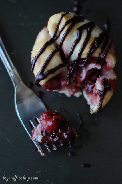 Overhead view of a Chocolate Cherry Monkey Bread Muffin with a bite on a fork