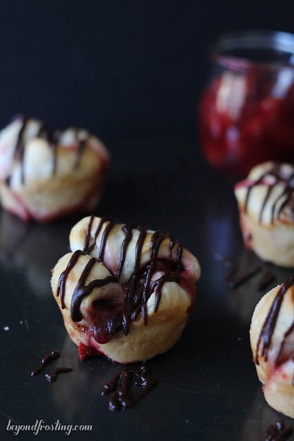 Overhead view of Chocolate Cherry Monkey Bread Muffins on a dark background