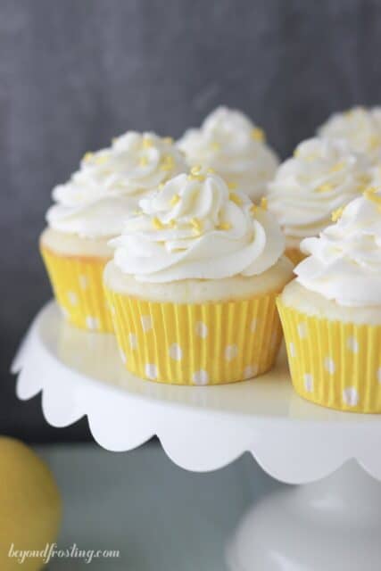 Lemon Cream Pie Cupcakes on a white cake stand